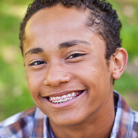 ortho-metal-braces smiling boy wearing braces
