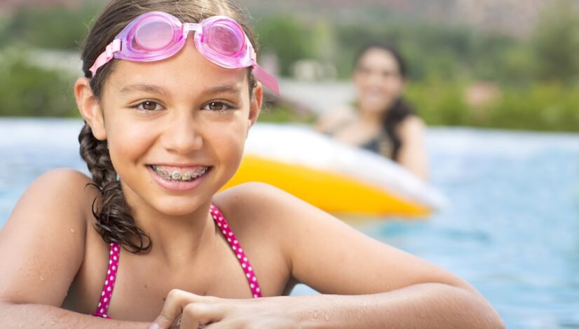 young girl with braces after pediatric orthodontic consultation