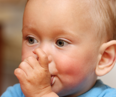 A little boy sucking his thumb.